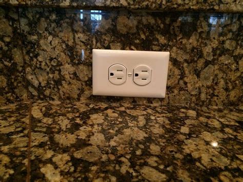 granite backsplash electrical outlet